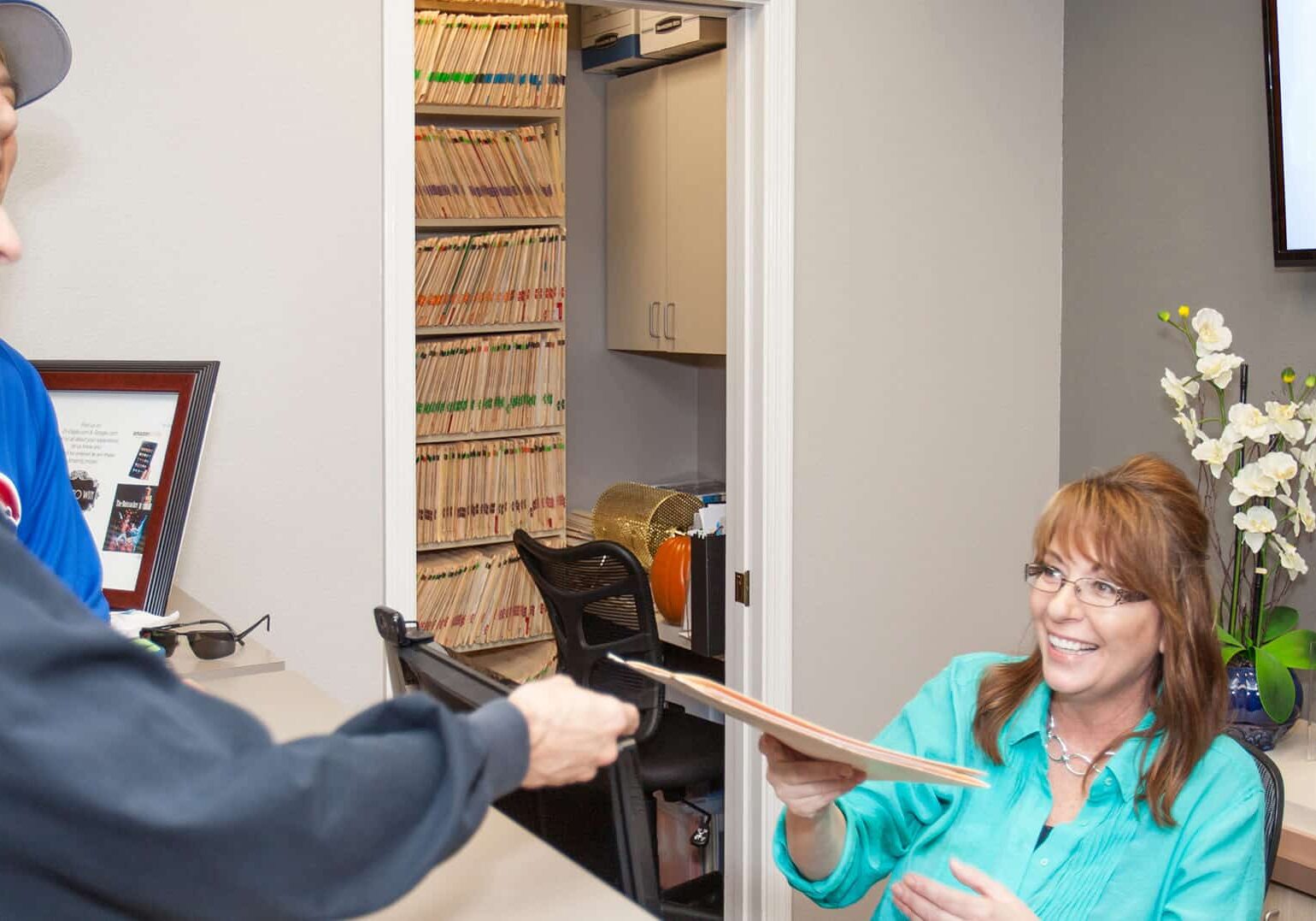Receptionist talking to patient at Arizona Biltmore Dentistry